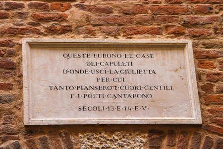 VERONA, ITALY - MAY 7, 2014: Memorial plaque on wall of the house Juliet in Verona, Italyのeditorial素材