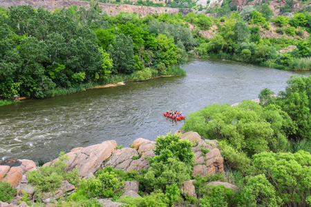 NIKOLAEV, VILLAGE GRUSHEVKA, UKRAINE - MAY 23, 2014: Rafting tourists with an experienced instructor on the river Southern Bugのeditorial素材