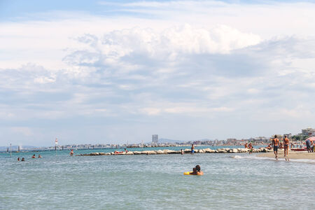 Bellaria Igea Marina, Rimini, Italy - August 14, 2014: Tourists sunbathe on  beach in the resort town Bellaria Igea Marina, Riminiのeditorial素材