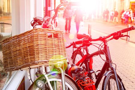 Bicycles  stands near wall on the street in Dutch cityの写真素材