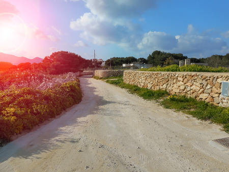 Rural road in the Sicilian island of Favignanaの写真素材