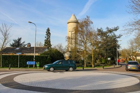 Meerkerk, municipality Zederik, Netherlands - April 13, 2015: Car on the road ring in Meerkerk, Netherlandsのeditorial素材