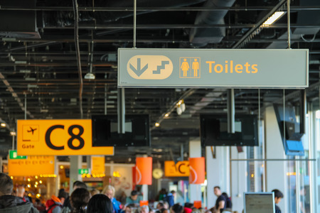 Amsterdam Schiphol, Netherlands - April 18, 2015:  Interior of Amsterdam Airport Schiphol. Passengers in the airport loungeのeditorial素材