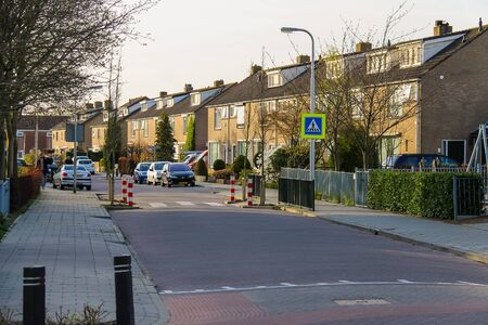 Meerkerk, municipality Zederik, Netherlands - April 13, 2015: People and cars on street in Meerkerk , Netherlandsのeditorial素材