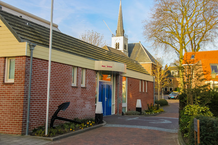 Meerkerk, municipality Zederik, Netherlands - April 13, 2015: Ancient sea anchor near the office in Dutch city Meerkerk, Netherlandsのeditorial素材