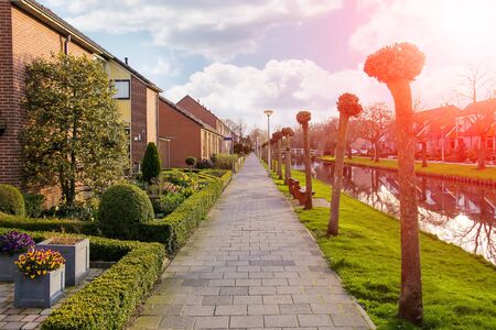 Picturesque houses on the canal in Meerkerk, Netherlandsの写真素材