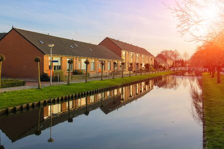 Picturesque houses on the canal in Meerkerk, Netherlandsの写真素材