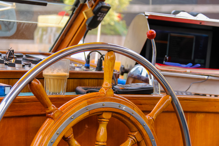 Ship helm in the captain's cabin of cruise boatの写真素材