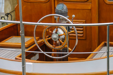 Steering wheel on the deck of a boat
