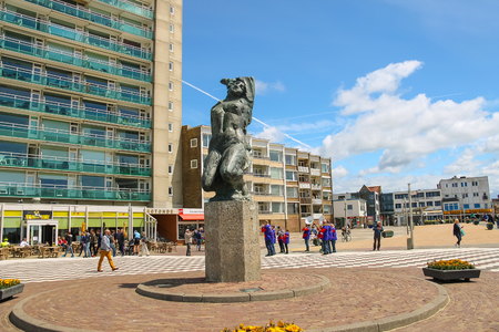 Zandvoort, the Netherlands - June 20, 2015: Tourists walking next to the bronze statue of naked girl on the Boulevard de Favauge.のeditorial素材