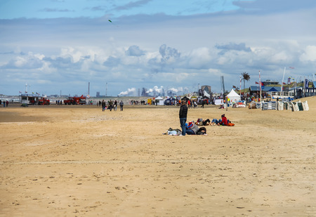 Zandvoort, the Netherlands- June 20, 2015: People on sandy beach near North sea. Zandvoort aan Zee is a main sea resort and touristic center with a long sandy beach bordered by coastal dunes.のeditorial素材