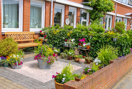 Street view of traditional house decorated with plants and furniture in Zandvoort, the Netherlandsの写真素材