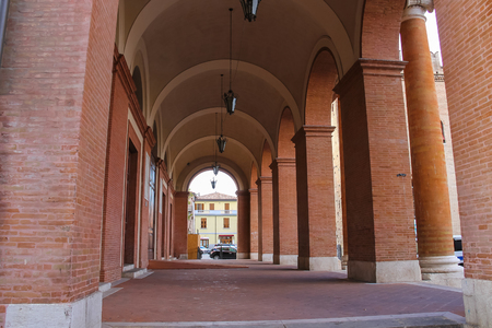 Archway with hanging lanterns of ancient building on Cavour square in Rimini, Italyのeditorial素材