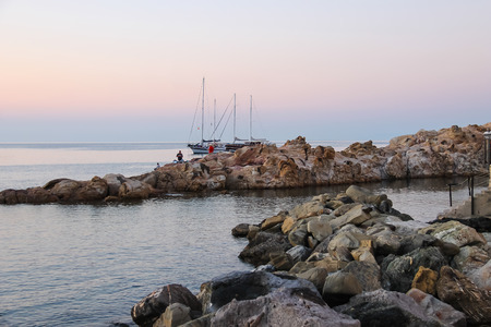 Marciana Marina, Italy - July 01, 2015: Coast of the Tyrrhenian Sea on the sunset. Marciana Marina is  one of the most important towns of Elba Island in region of Tuscany, Italyのeditorial素材