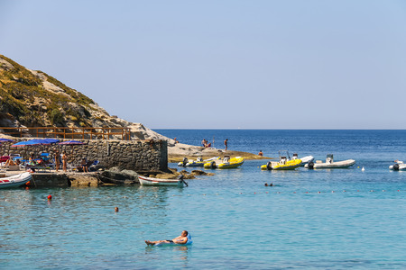 St Andreas, Italy - July 01, 2015: People on the coast of Tyrrhenian Sea, Sant Andreas on Elba Island, Italyのeditorial素材