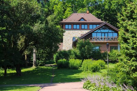 Picturesque houses between trees in Stryiskyi Park, Lviv, Ukraineのeditorial素材