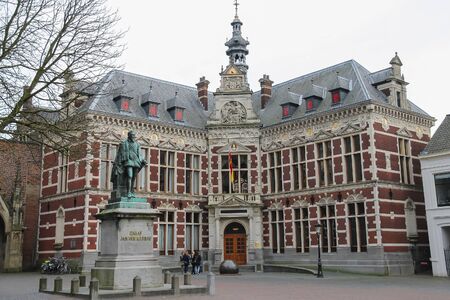 Utrecht, the Netherlands - February 13, 2016: University Hall of Utrecht University and statue of Count (Graaf) Jan van Nassau in Dom Squareのeditorial素材