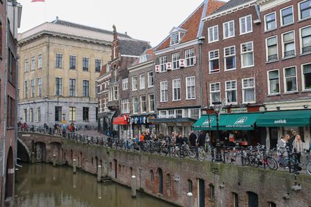 Utrecht, the Netherlands - February 13, 2016: People walking next to Oudegracht canal in historic city centreのeditorial素材