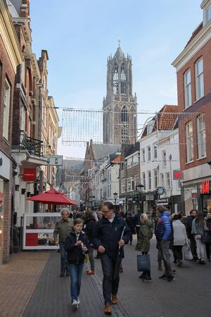 Utrecht, the Netherlands - February 13, 2016: People walking in historic city centre. View to Dom Tower of the St. Martins Cathedralのeditorial素材