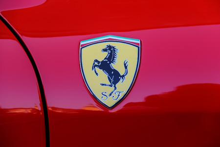 Spilamberto, Italy- October 02, 2016: Ferrari logo on the side part of red car close-upのeditorial素材