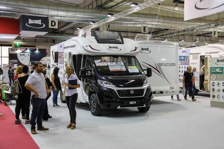 Parma, Italy - September 17, 2016: People looking at auto in annual exhibition of camper vans (Salone del Camper)のeditorial素材