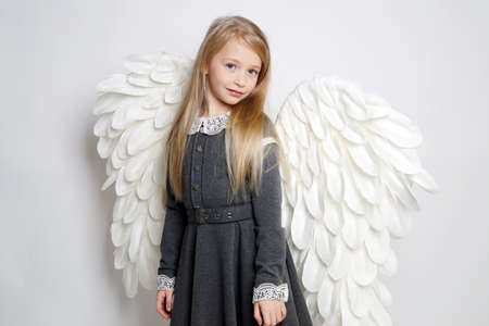 Pretty young lady with angel wings.Isolated studio shotの写真素材