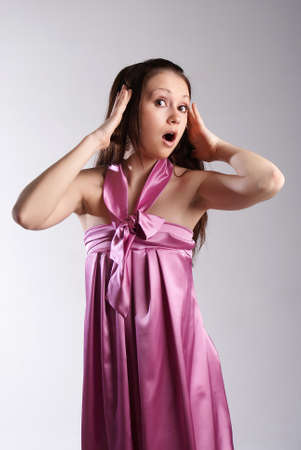 Girl in blue dress posing.Isolated studio portraitの写真素材