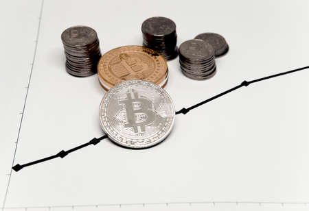 Cryptocurrency in the background of dollars.isolatedの写真素材
