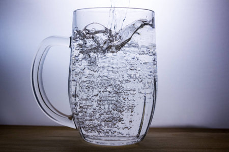 beer mug with water on wooden desk