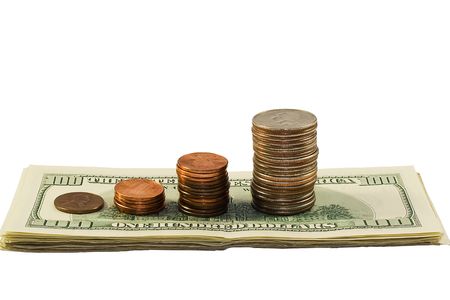 stack of coins and dollars isolated on white