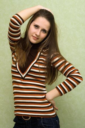 beautiful young girl touching hairの写真素材