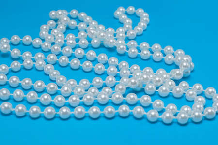 string of pearls on blue backgroundの写真素材