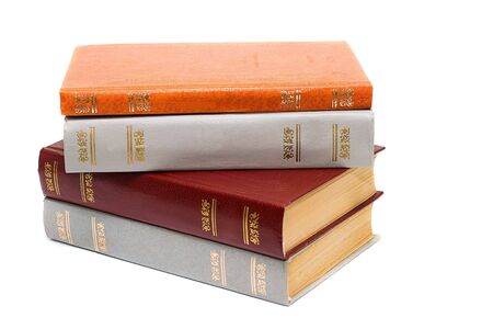 Stack of old books isolated on white backgroundの写真素材