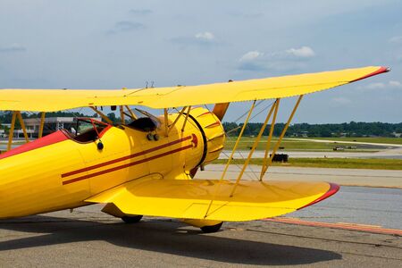 yellow vintage airplaneの写真素材