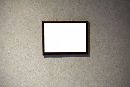 empty frame in a room against a grunge wall