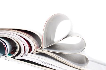 A stack of magazines isolated against a white backgroundの写真素材