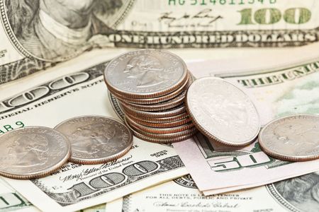 Close up of dollars and coinsの写真素材