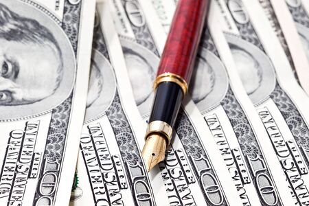 close-up pen on the moneyの写真素材