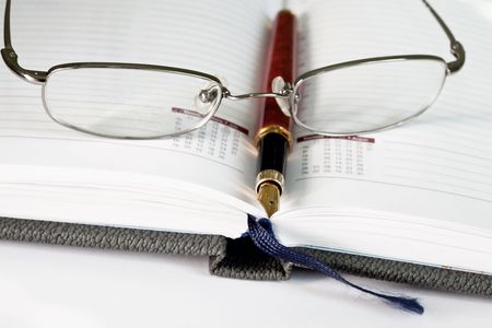 pen, glasses and agendaの写真素材