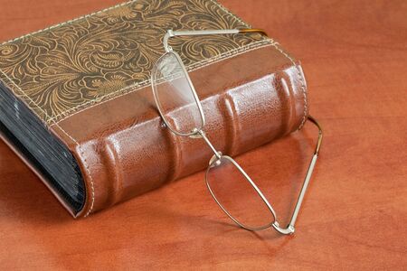 Book and Glasses on the tableの写真素材