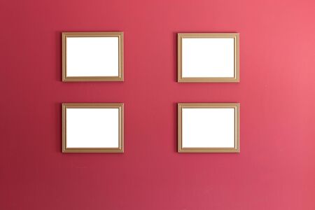 picture frames on red wallの写真素材