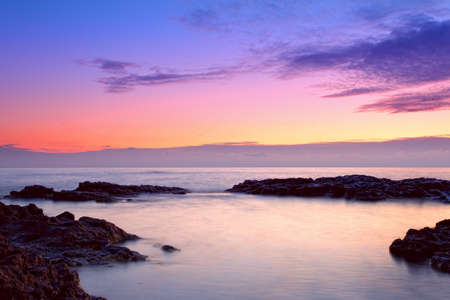 colorful sunrise on the rocky coast, Florida, USAの写真素材