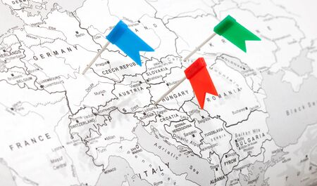 Travel concept with flag pushpins and map