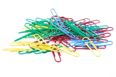 Close-up of multi-colored paper clips isolated on a white backgroundの写真素材