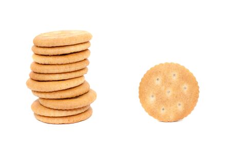 Round salty crackers on white background