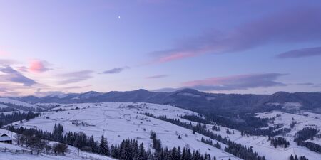 winter mountain landscape at sunrise. Sunrise in Carpathian Mountains, Ukraineの写真素材