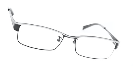 Classic metal-framed glasses isolated on whiteの写真素材