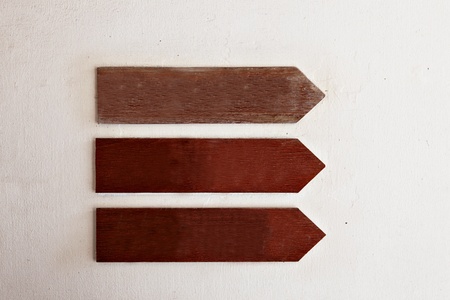 wooden pointers on the old wall のeditorial素材