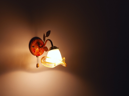 Lighted classic sconce on the wall