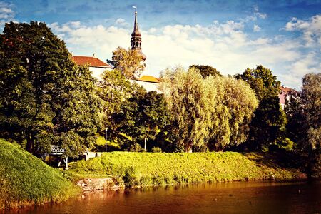 Retro style postcard of park with pond in old european cityの写真素材